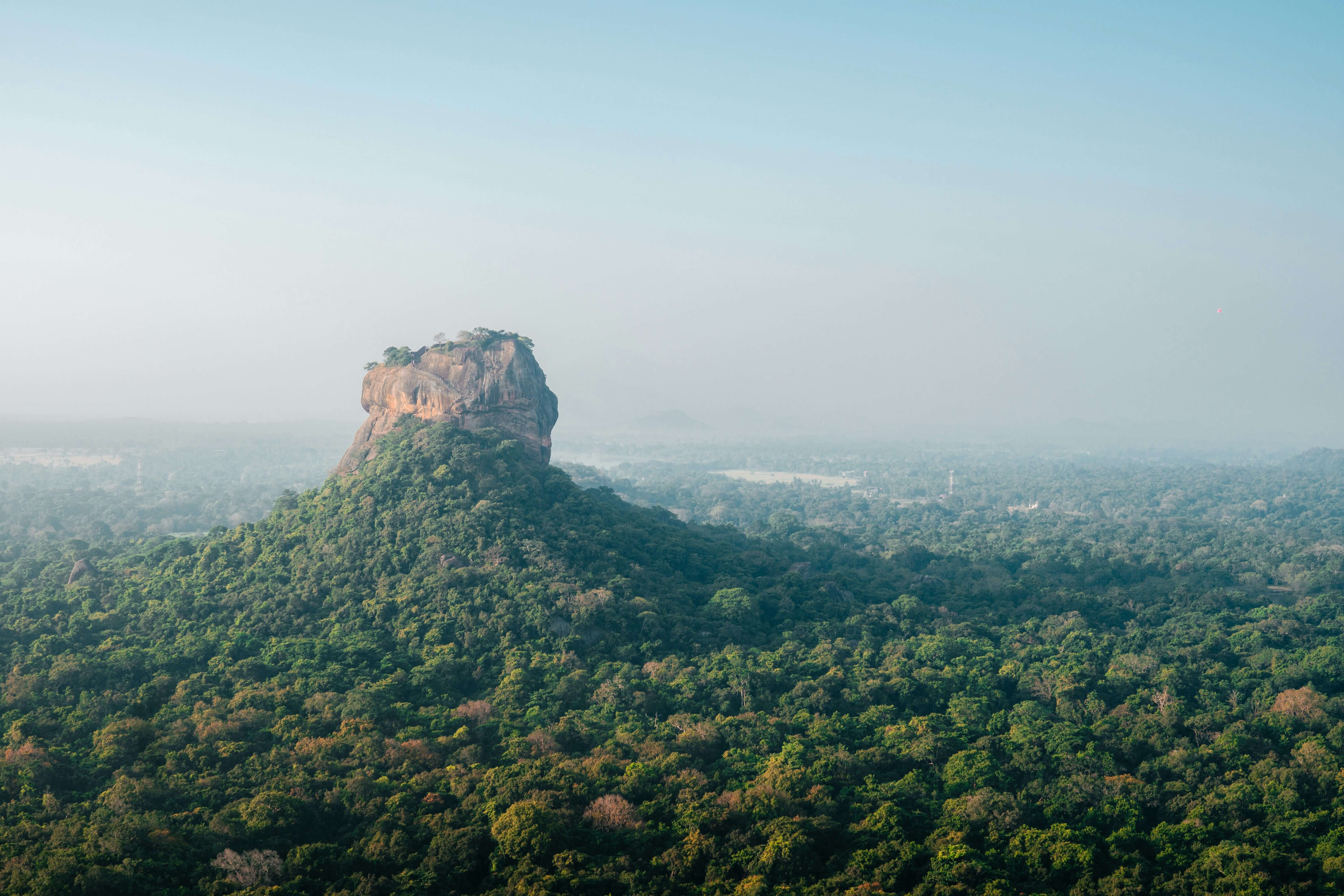 Sigiriya Rock Fortress UNESCO World Heritage Site in Sri Lanka - ancient rock palace with celestial maiden frescoes, water gardens, and panoramic summit views